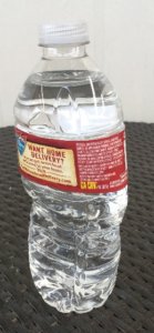 Deformed plastic bottle of water