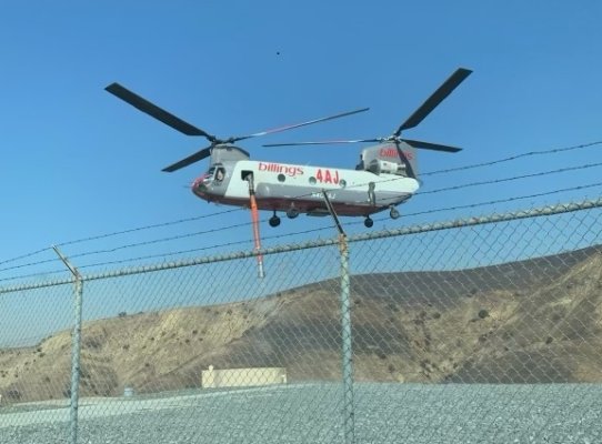 Fire-fighting helicopter hovers over unusual water source - the Heli-Hydrant.