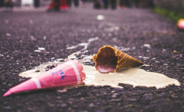Ice cream cone dropped on the ground, melting