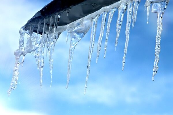 Icicles hanging from roof edge